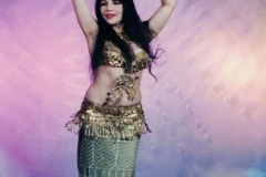 Aisha Ali wearing gold coin costume with a gold Asyut skirt.